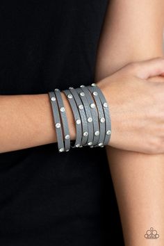 A thick gray leather band has been spliced into numerous gray strands. Featuring sleek silver frames, glittery white rhinestones are sprinkled across the leather bands for a sassy finish. Features an adjustable snap closure. Sold as one individual bracelet. ORDERED 05 MAR 19p9di-ursv-129xx Silver Wrap Bracelet, Paparazzi Accessories Jewelry, Silver Strand, Snap Bracelets, Silver Frames, Paparazzi Accessories, Gray Leather, White Rhinestone, Leather Wrap Bracelet