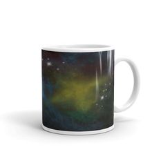 a coffee mug with an image of the stars and galaxy in it on a white background