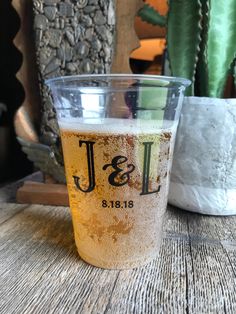 a beer glass sitting on top of a wooden table