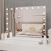 a white dresser topped with a mirror next to a night stand and lights on the wall