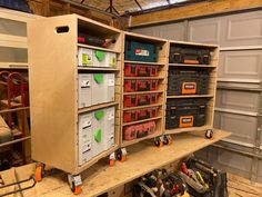 a workbench filled with lots of tools and other items in storage area next to garage door