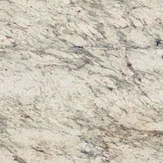 a white marble counter top with red speckles