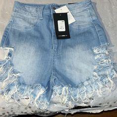 Fashion Nove Distressed Jean Shorts Size 3 Nwt Was $34.99 Now Only $15 Ripped Stretch Shorts For Spring, Stretch Ripped Shorts For Spring, Distressed High Waist Fitted Shorts, Ripped Fitted Shorts, Distressed Fitted Short Bottoms, Fitted Distressed Short Bottoms, Fitted Distressed Shorts, Fitted Ripped Light Wash Shorts, Spring High Rise Ripped Shorts