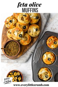 mini muffins with olives and feta cheese on top in a muffin tin