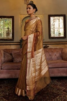 Copper saree with textured pattern and zari floral woven motifs on contrast border. Comes with unstitched blouse piece. - Aza Fashions Formal Cotton Silk Pre-draped Saree With Self Design, Elegant Slub Silk Pre-draped Saree With Self Design, Copper Saree, Gold Saree With Printed Border, Semi-stitched Gold Tussar Silk Pre-draped Saree, Gold Embroidered Pre-draped Tussar Silk Saree, Gold Tussar Silk Bollywood Pre-draped Saree, Gold Handloom Tussar Silk Pre-draped Saree, Border Saree