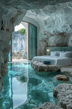 a bedroom with a pool in the middle that looks like it has been made into a cave