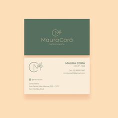 a business card for maura corda, with the letter m in gold and green