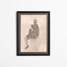 a painting hanging on the wall next to a white wall with a black framed object