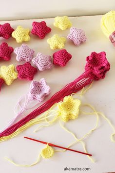 crocheted flowers and yarn on a table