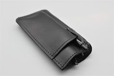 "Black Leather Sunglass Case | Leather Glasses Case | Sunglass Eyewear Glasses Cover | Sunglasses Case | Custom Glasses Case Check out these durable handcrafted glasses cases! Created from single piece of premium French calfskin, each case is carefully stitched together with the greatest attention to detail. The cases measure 3\" wide, and 6\" tall...the perfect size for nearly all reading glasses (also works well for most sunglasses.) On front of the case is another pocket, for conveniently car Modern Leather Cases For Personal Use, Classic Leather Cases For Personal Use, Black Leather Case With Card Slots, Black Leather Cases With Card Slots, Leather Rectangular Wallet, Black Cases With Pen Holders For Gifts, Leather Wallets With Rectangular Case For Gift, Leather Case With Card Slots For Everyday Use, Leather Sunglass Case