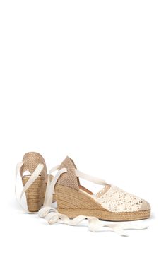 Scalloped edges on the crochet toe lend dainty detail to this beach-ready, espadrille-inspired shoe set atop a braided jute wedge. 3 3/4" heel Wraparound ankle strap with tie closure Textile upper/synthetic lining/jute and rubber sole Made in Spain Summer Vacation Sandals With Crochet Trim, Elegant Cream Wedge Sandals For Beach, Casual Spring Sandals With Crochet Trim, Elegant Straw Espadrilles For Vacation, Straw Ankle Strap Espadrilles For Beach Season, Straw Ankle Strap Espadrilles For Beach, Straw Espadrilles With Ankle Strap For Beach, Ankle Strap Espadrilles For Beach Season, Beach Espadrilles With Ankle Strap In Straw