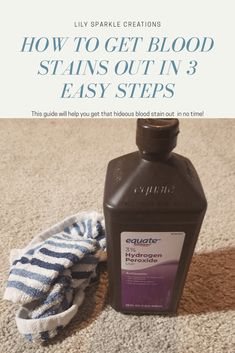 a bottle of stain sitting on top of a carpet next to a pair of socks