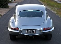 a silver car parked on the side of a road