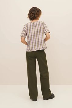 An elevated everyday top, made from 100% certified Fairtrade organic cotton poplin shirting in a joyful woven check. The Adrian Top has a standard fit with bust darts for gentle shaping and side splits for ease of wear. It features a binding detail at the cuffs and hem, and fastens with a button and loop at the back. This garment is completely plastic-free. Sizing: This style is true to size. We recommend taking your normal size. Pink Tartan, Garment Pattern, Garment Labels, Side Splits, Denim Coat Jacket, Knitwear Tops, Denim Coat, Easy Wear, Cotton Poplin