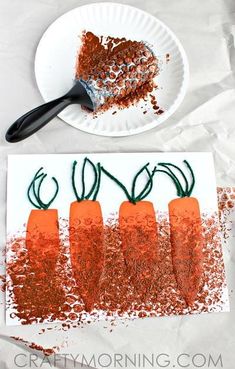 carrots are arranged on a paper plate next to a piece of cake that has been cut into smaller pieces