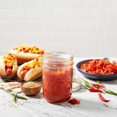 hotdogs and other condiments on a table