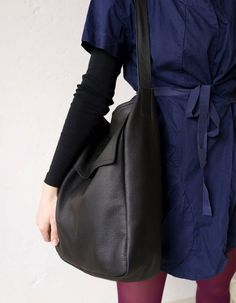 "A large bag on shoulder and hand. Made of strong thick black leather. Inside without lining with one pocket, 18x 18 cm (7\" x 7\"). Dimensions: height: 35 cm, 13,8\" width 30 cm, 11,8\" depth 11 cm, 4, 3\" ear length about 66 cm, 26\". Fits A4. For these bag, please expect 1 week for your item to be made and prepared for shipment. Standard delivery time: European union: 4 - 10 days Europe (not EU): 7 - 14 days U.S.A., Canada: 10 - 20 days Australia, South America, Asia, India, North Africa: 1 - Structured Bag, Leather Fanny Pack, Festival Bag, Black Leather Tote, European Union, Leather Diy, Large Bag, North Africa, Everyday Bag