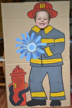 a cardboard box with a fireman painted on it