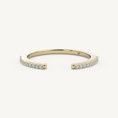 a yellow gold ring with diamonds on it