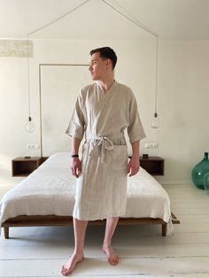 "Cozy Bathrobe, a unisex kimono linen robe for ultimate relaxation. Made from breathable linen, ideal for home lounging or as a post-bath wrap. Offers warmth and comfort with below-the-knee length, 3/4 sleeves, shawl collar, and belt. Features two pockets for convenience. A perfect gift to elevate any at-home collection. Specifications: ∙ Model: 178 cm/5'10\" (M, Natural) ∙ Length: 115 cm / 45.2\" ∙ Below-the-Knee length ∙ 3/4 sleeves ∙ Shawl collar ∙ Includes a belt with loops ∙ Two pockets ∙ O Mens Lightweight Cotton Rustic Robes, Relaxed Fit Linen Sleep Robe, Casual Robe For Relaxation, Casual Linen Kimono For Loungewear, Casual Linen Kimono With Relaxed Fit, Beige Linen Kimono For Loungewear, Relaxed Fit Linen Robe For Home, Linen Bathrobe, Summer Lounge