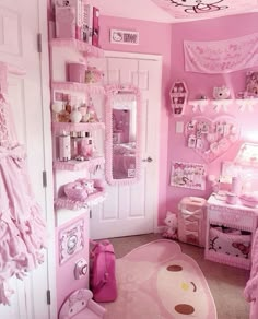 a bedroom decorated in pink and white with hello kitty decor on the walls, bedding, rugs and other items