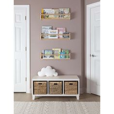 three shelves with baskets on them in front of a door and an open door to another room