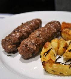 the sausages and potatoes are on the plate ready to be eaten