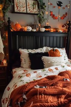 a bed with pumpkins and other decorations on it