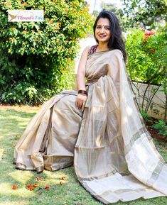 This summery Beige handwoven Maheshwari Saree apt for all occasions. Light and breathable fabric Made with Silk and Mercerized Cotton with contrast border .And jute at the corner. Blouse part of length of saree. Blouse worn by model is not included. 5.5 metres. Dry cleaning only. Summer Tissue Silk Saree With Dupatta, Summer Traditional Wear In Cotton Silk With Zari Work, Summer Traditional Cotton Silk Wear With Zari Work, Summer Cotton Silk Traditional Wear With Zari Work, Summer Cotton Silk Dupatta With Cutdana Details, Summer Cotton Silk Dupatta With Cutdana, Summer Anarkali Saree With Cutdana, Summer Festive Chanderi Saree, Festive Summer Chanderi Saree