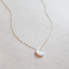 Opal crescent moon charm is a super-cute size and glides along the chain. Each one shines beautifully in the light! Details: Available in 14kt gold filled, 14kt rose gold filled + sterling silver White opal moon charm 16 inches long with 3 inch extender (can be worn 16-19 inches) Crescent Moon Necklace Gold, Angel Wings Jewelry, Character Sheets, Pretty Ring, Gift Inspo, Necklace Ideas, Aesthetic Things, Crescent Moon Necklace, Moon Jewelry