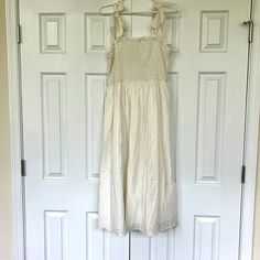 Perfect For Wedding Shower Or Rehearsal Dinner, Especially For Summer Brides! Never Worn. Straps Are Adjustable As They Tie In Bows. Stretchy Top. Mid Length Cream Sleeveless Dress With Smocked Bodice, Cream Sleeveless Midi Dress For Brunch, Elegant Sleeveless Sundress With Smocked Bodice, Cream Sleeveless Sundress For Brunch, White Sleeveless Dress With Smocked Bodice, Cream Sleeveless Sundress Midi Dress, Sleeveless Beige Midi Dress With Tie Straps, Cream Sleeveless Sundress Midi, Beige Sleeveless Midi Dress With Tie Straps