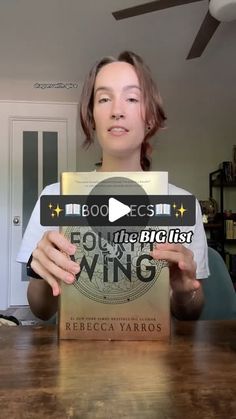 a woman holding up a book in front of her face with the title, becoming the best wing