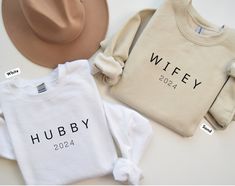 These personalized sweatshirts are simple and elegant. Ideal as a wedding or engagement gift. These shirts also make great engagement announcements. Available in different colors.  The gildan 18000 sweatshirts are very comfortable and soft.  ♥ PRODUCTION TIME: 1-5 days (Usually 2-3 days)   ♥ SHIPPING TIME: 2-5 days (Usually 3 days)   ♥ PRODUCT DESCRIPTION: Gildan 18000 Unisex Sweatshirt  This sweatshirt feels cozy and is the perfect choice for those colder months. Quality print makes. 50% cotton Couple Honeymoon, Hubby Wifey Shirts, Unique Bridal Shower Gifts, Wifey Sweatshirt, Mrs Sweatshirt, Bride Sweatshirt, Honeymoon Outfits, Couples Sweatshirts, Personalized Bride