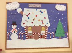 a bulletin board with a snowman and a house