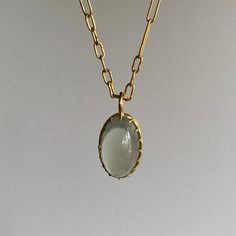 Dreamy sage green light beams from within this entrancing moonstone, grasped by Rosanne Pugliese's stunning scallop prong setting. 18k yellow gold Moonstone 12mm x 19mm (1/2" x 13/16") Pendant can be purchased alone or with the following chain options: • 22k yellow gold link chain, 18" long • 14k medium link chain, adjustable 17.5" & 19" • 14k medium link chain, adjustable 18.5" & 21" • 14k fine chain, adjustable 18" & 22" Chalcedony Cabochon Yellow Gold Jewelry, Yellow Gold Chalcedony Jewelry With Cabochon, Gold Jewelry With Large Oval Cabochon Stone, Elegant Untreated Moonstone Jewelry, Sage Green Light, Gold Link Chain, Design Movements, Newport Ri, Gold Link