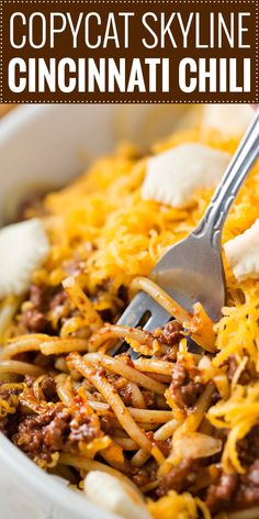 a white bowl filled with chili and cheese