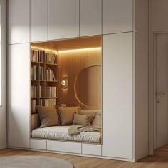 a room with a couch, bookshelf and some shelves in it that are filled with books