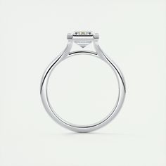 a close up view of a diamond ring on a white background with the center stone set in