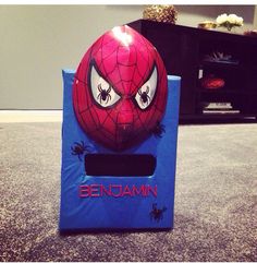 an egg shaped like a spiderman with eyes