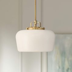 a white light hanging from a ceiling in a room