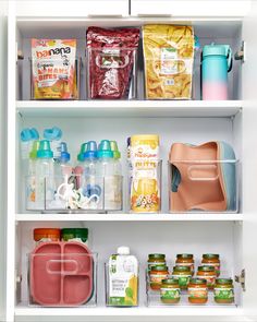 an organized pantry with plastic containers, food items and other household care products on shelves