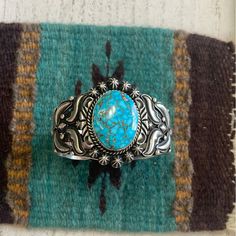 * Main Stone : Turquoise * Metal : Sterling Silver * Jewelry Type : Bracelets * Signed? : Signed * Tribal Affiliation : Navajo * Artisan : Rick Werito This Is A Wonderful Piece Made By The Navajo Artist Rick Werito . This Cuff Is Made Of Sterling Silver And Turquoise. This Piece Measures 1 3/4 Inches Wide, 5 3/4" Inside Circumference And A 3/4“ Gap. The Bracelet Is Signed By The Artist And Stamped Sterling. A True Collectors Piece!! Please Contact Me With Any Questions And Thank You For Looking. Vintage Navajo Jewelry, Southwestern Hallmarked Sterling Silver Jewelry, Southwest Jewelry Navajo Silver Cuff Bracelets, Native American Bracelets, Southwestern Style Blue Nickel-free Cuff Bracelet, Unique Nickel-free Turquoise Cuff Bracelet, Blue Statement Necklace, Chunky Bead Necklaces, Southwestern Turquoise Nickel-free Jewelry