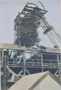 an old photo of a large structure that looks like it has been destroyed into pieces