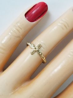 "Thanks for shopping our vintage estate store. We tend to sell well below wholesale and truly hope you enjoy all of our items. Many of the items are one of a kind, so please enjoy scrolling through the pictures and hopefully something will catch your eye. Brown spots are from reflections or camera. Estate 14k yellow gold cross Christ band or ring. Ring size: 6.25 can be sized up or down for $20 Setting: 3/8\" 8mm by 1/2\" Band width: 1.5mm Weight: 1.01 grams Beautiful detailed cross ring, marked Vintage Cross Jewelry For Anniversary, Vintage Cross Ring As Gift, Collectible Yellow Gold Cross Jewelry, Vintage Cross Ring For Gift, Beach Rings, Brown Spots, Cross Ring, Gold Halo, Gold Cross