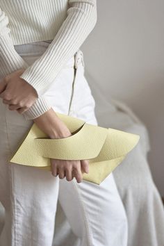 Customizable with a message and gift wrapped, the versatile Balance Clutch Purse is handmade in premium Italian cowhide with unique wrist handle design. A signature style from our 2020 Balance collection, it is handcrafted with a clean and minimal design, finished with handpainted edges, it comes with a possible monogram, name or your custom text), a smooth leather lining and gift wrapped in a 100% cotton dust bag with the LINDASIETO brand logo print. Outer: 100% Italian Cowhide Inner: 100% Ital Modern Cream Bag For Gift, White Envelope Bag For Gift, Modern Yellow Bags Perfect For Gifts, Modern Yellow Bags For Gifts, Modern Envelope Bag For Gifts, Modern Yellow Bag As A Gift, Modern Envelope Bag As Gift, Yellow Rectangular Clutch For Gift, Yellow Rectangular Clutch As Gift