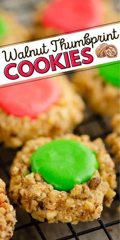 cookies with green and red frosting sitting on top of a cooling rack in front of a sign that says walnut fudgerint cookies