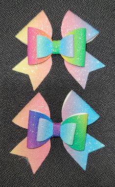 Pair of pastel and bold rainbow faux leather bow. Llamas With Hats, Rainbow Bow, Metal Hair Clips, Leather Bow, Leather Bows, Metallic Hair, Barrette Clip, Barrettes, How To Find Out