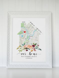 a white frame with a map and flowers on it