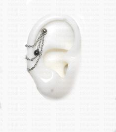 a pair of ear plugs with chains attached to them