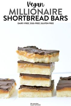 five vegan shortbread bars stacked on top of each other with chocolate frosting